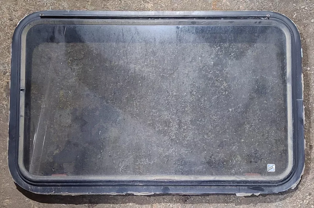 Used Black Radius Emergency Opening Window : 35 1/2 ” W x 21 3/4 ” H x 1 5/8 ” D