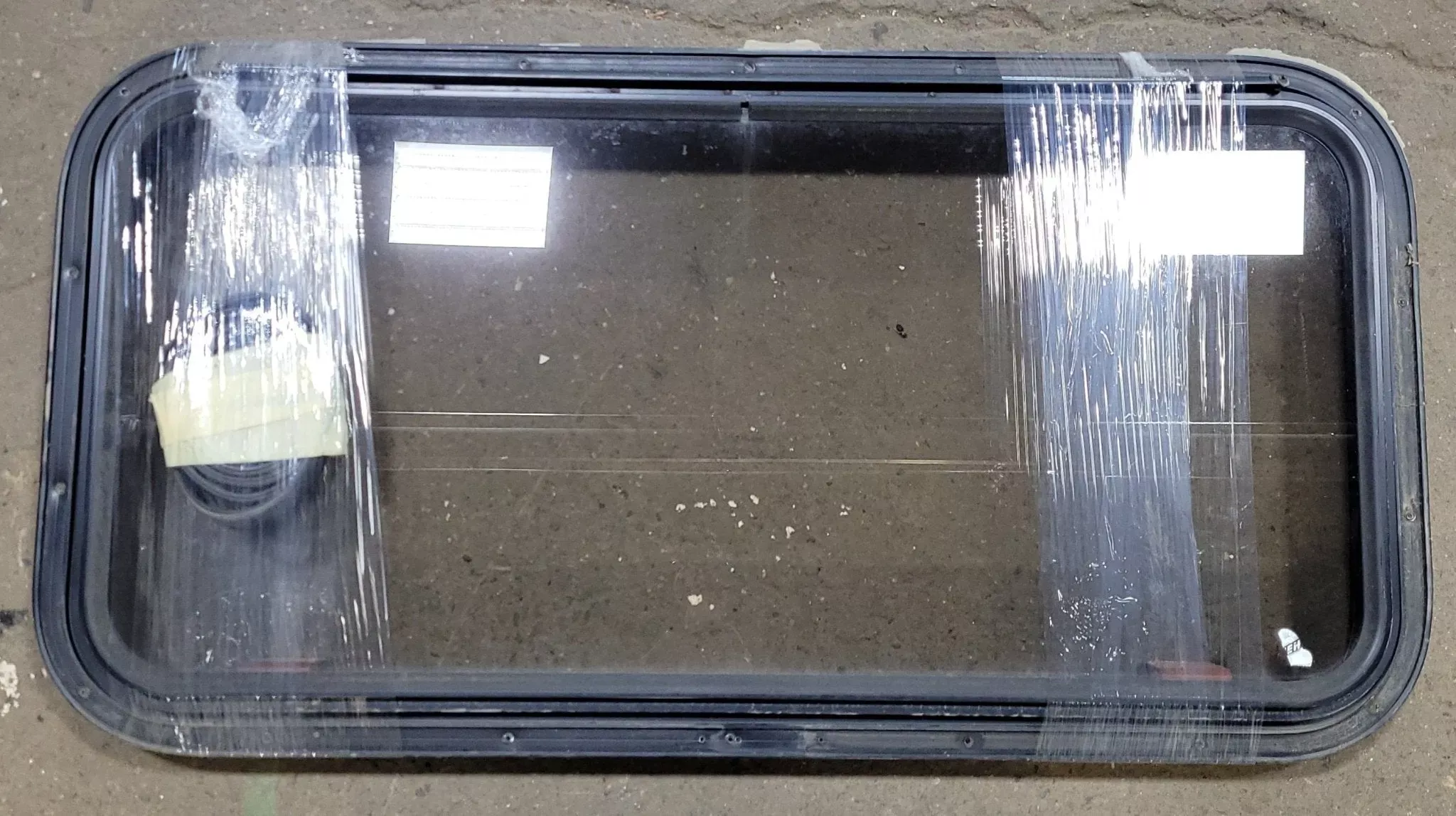 Used Black Radius Emergency Opening Window : 35 5/8 ” W X 17 3/4 ” H X 2 ” D