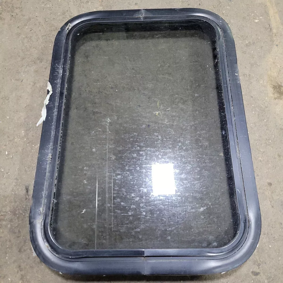 Used Black Radius Non-Opening Window : 24 1/4 ” X 16 3/4 ” X 2 ” D