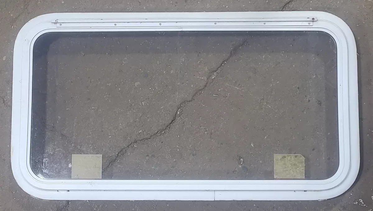 Used White Radius Emergency Opening Window : 35 1/2 ” W x 18 3/4 ” H x 1 7/8 ” D